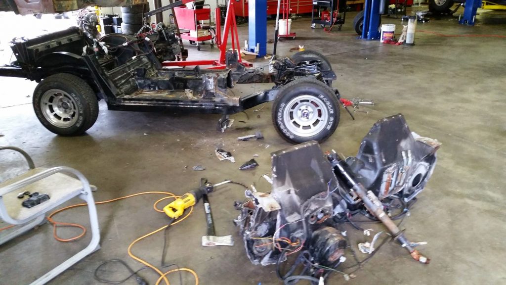 78 corvette chassis and partial floor pan with dash hacked off.