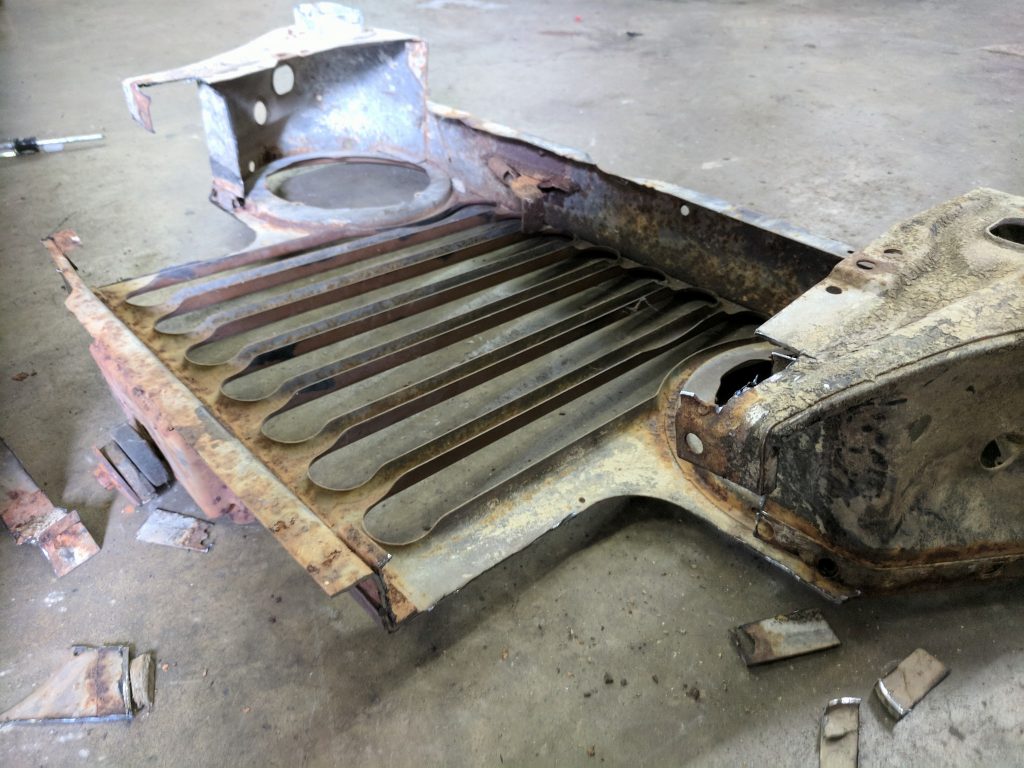 hacking the jeep grill so it will fit in the corvette frame. 