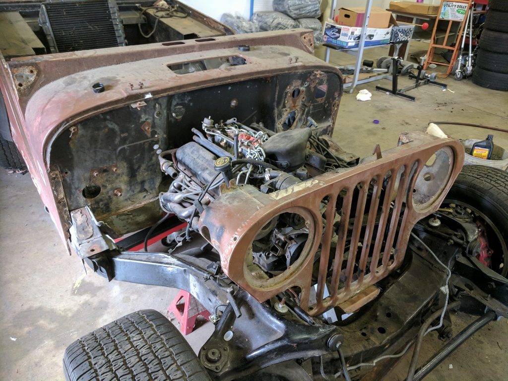 jeep grill positioned on the corvette frame
